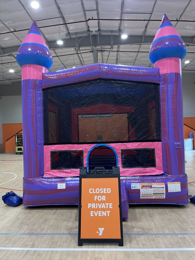 Bounce house rental set up indoors at a YMCA in Tulsa
